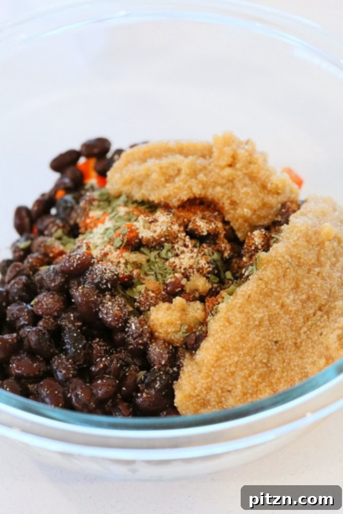 Bowl of black beans, peppers, and spices before mixing