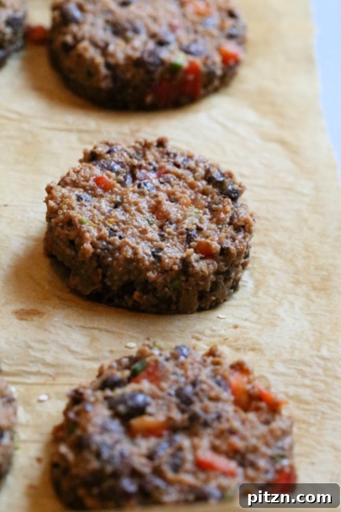 Amaranth black bean mixture being pressed into a patty using a cookie cutter
