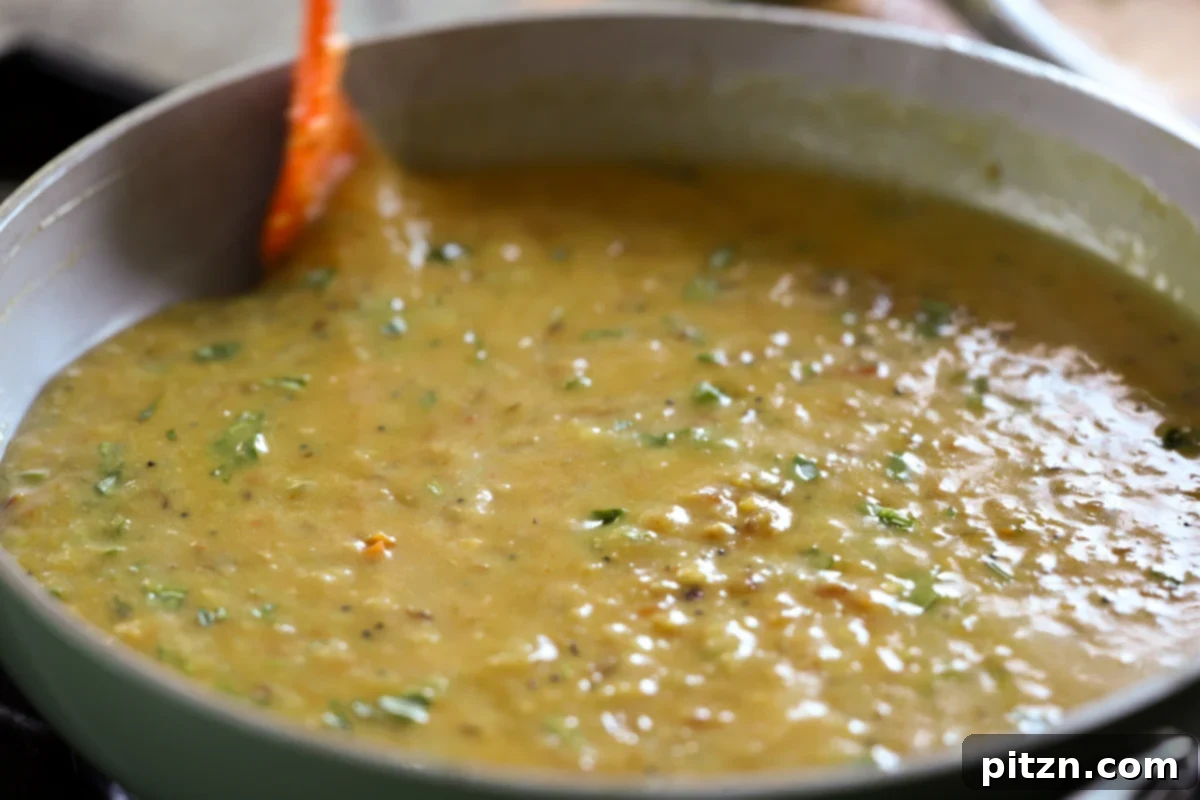 Dal Fry simmering in the pan after cilantro has been added