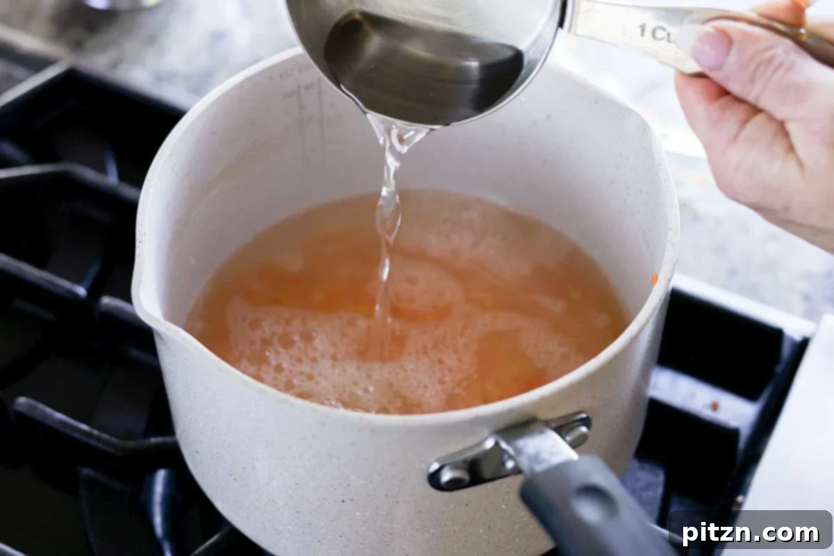 Adding water to a pot of rinsed lentils