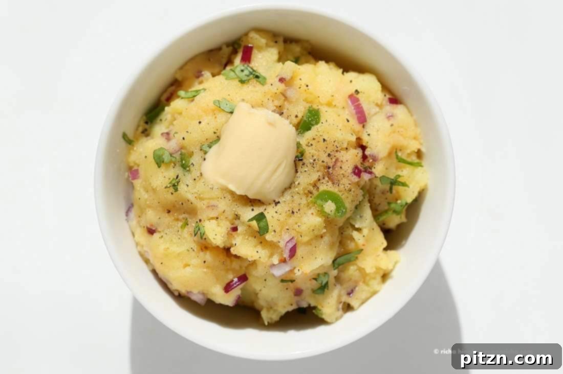 Aloo Bharta: Spiced Indian Potato Perfection 6 Delicious Aloo Bharta topped with a rich drizzle of olive oil, highlighting its texture and aromatic spices, ready to eat.