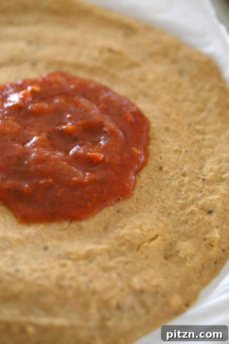 Easy Gluten Free Yeast Free Vegan Pizza Base 7 Gluten-free Yeast-free Vegan Pizza Crust par-baking in the oven, creating a firm base.