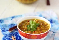 Comforting Whole Red Lentil & Mung Bean Daal Soup, Infused with Shallots and Tomatoes. Vegan and Gluten-Free.