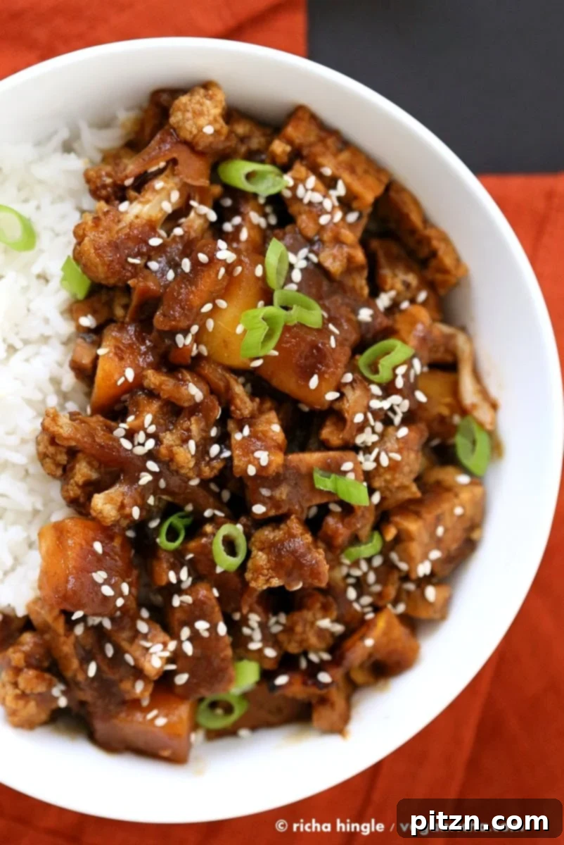 Sweet Date Teriyaki Tempeh Butternut Cauliflower 3 Close-up of Tempeh, Cauliflower, and Butternut Squash in Teriyaki Sauce, garnished with sesame seeds