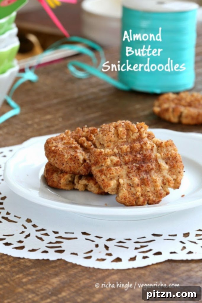 Close-up of golden brown vegan snickerdoodles with cinnamon sugar coating