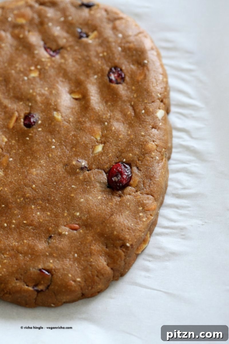 Vegan Gingerbread Biscotti with cranberries, almonds, candied ginger. Easy Crispy Spiced Biscotti Recipe to dunk in a cup of tea. Drizzle with white or dark chocolate. | VeganRicha.com #vegan #gingerbread #biscotti #recipe