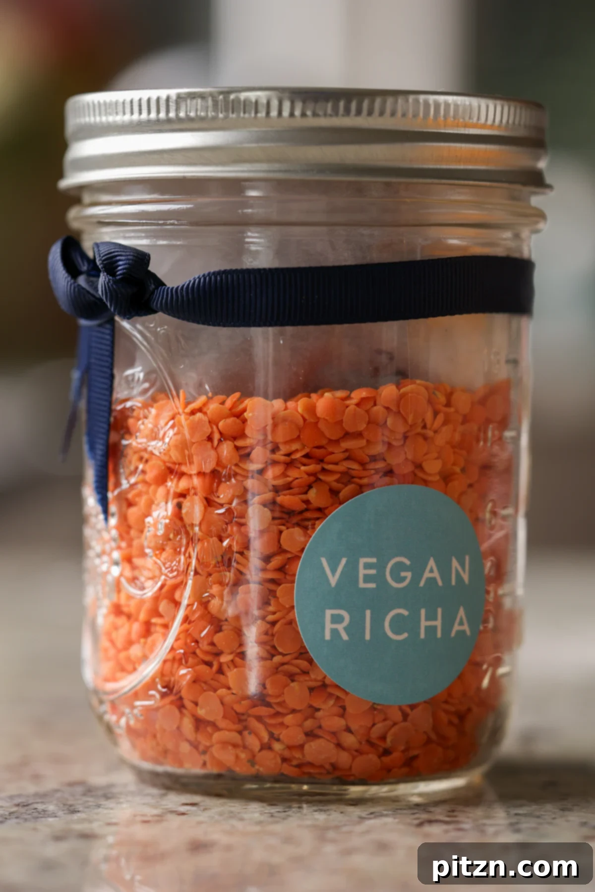 Dal Tadka Lentil Soup Mix in a Jar 3 Single jar of vibrant red lentil soup mix, ready for gifting or cooking.