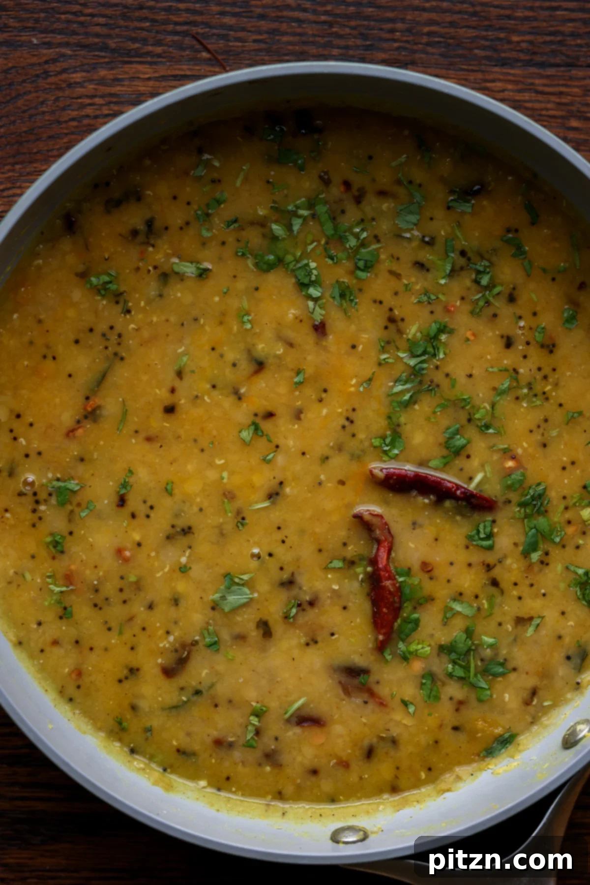 Dal Tadka Lentil Soup Mix in a Jar 4 Cooked dal tadka simmering gently in a pan, ready to be served.