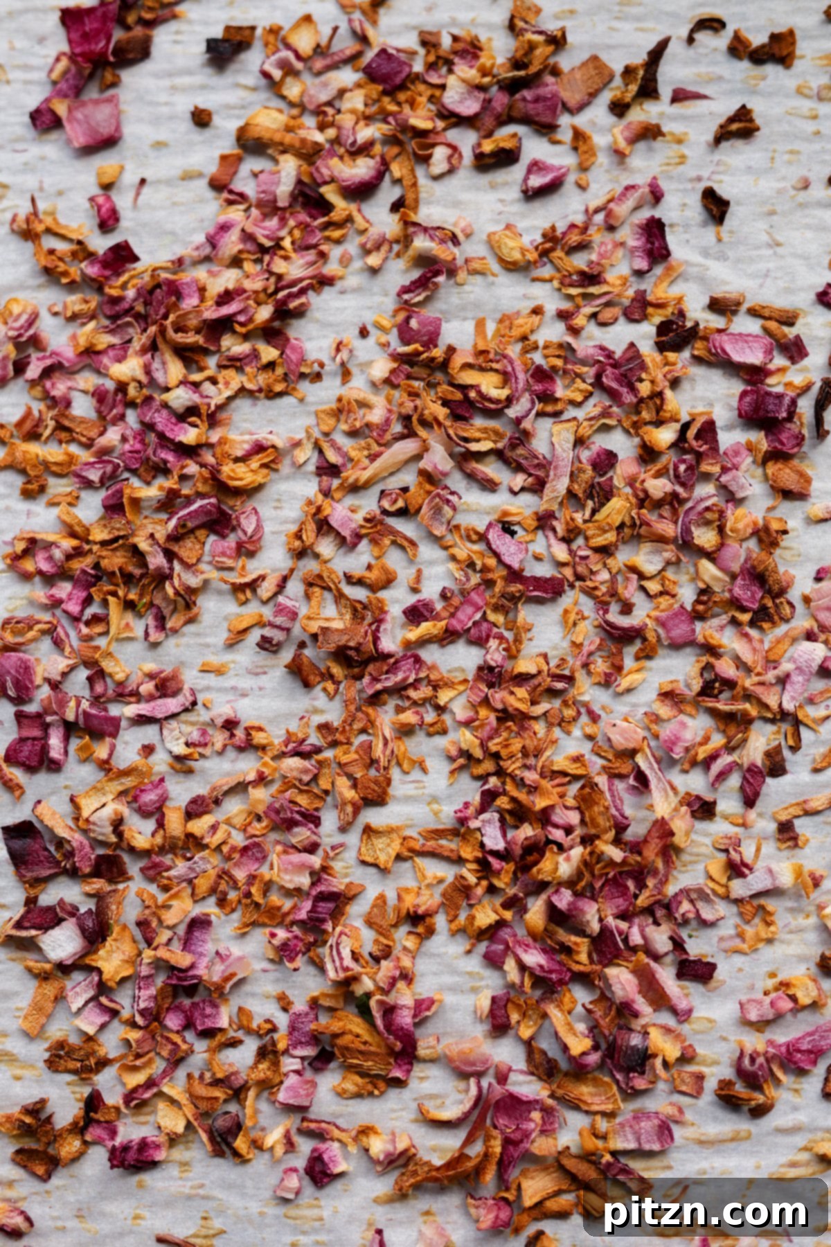 Dal Tadka Lentil Soup Mix in a Jar 5 Dried onion flakes spread on a baking sheet after oven drying.