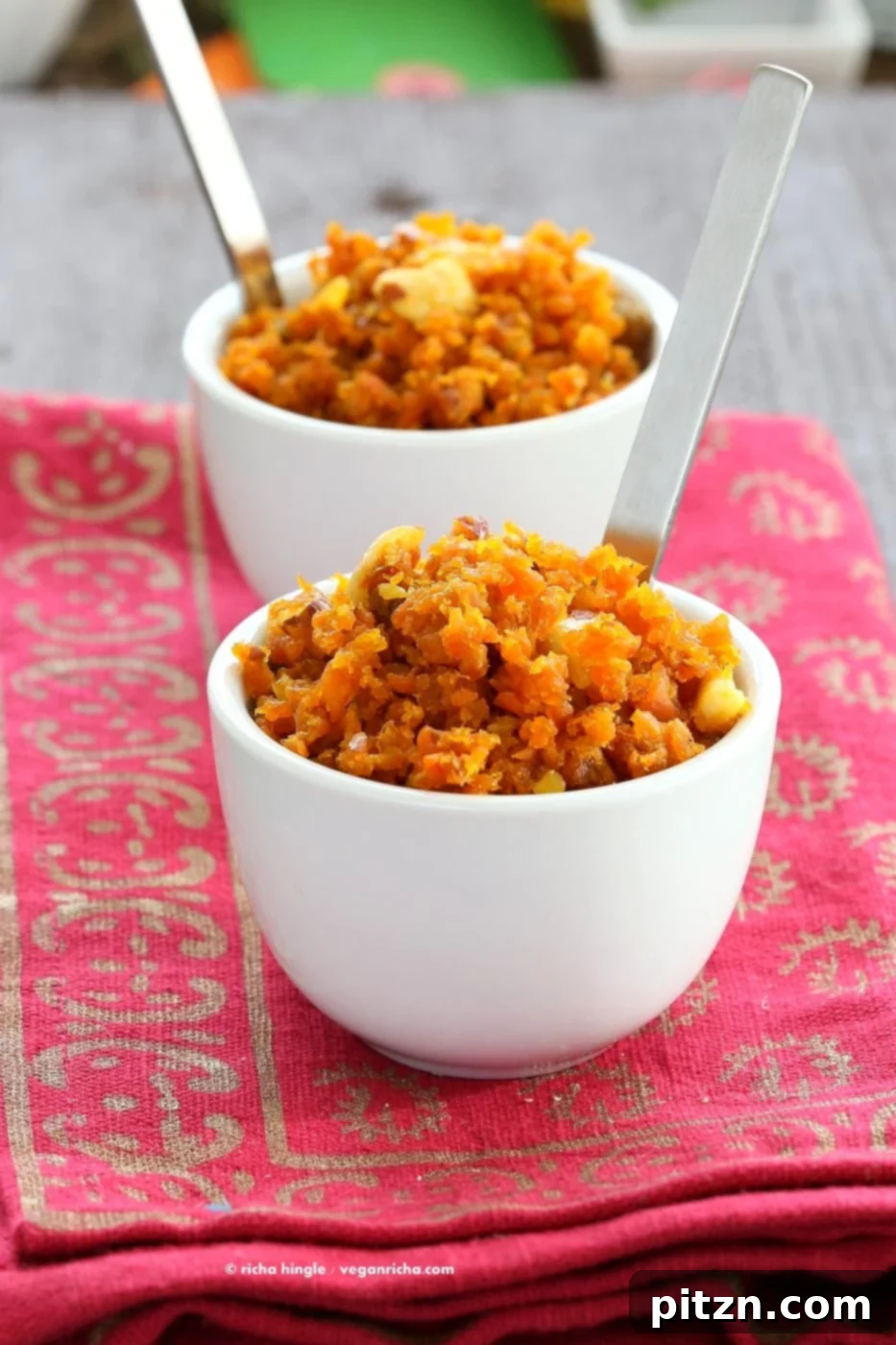 Indulgent Vegan Carrot Halwa 7 A close-up shot of the creamy and rich Vegan Carrot Halwa (Gajar Halwa), beautifully garnished with toasted nuts and saffron strands, highlighting its inviting texture and appetizing appearance. A perfect dairy-free, gluten-free, and soy-free Indian dessert.