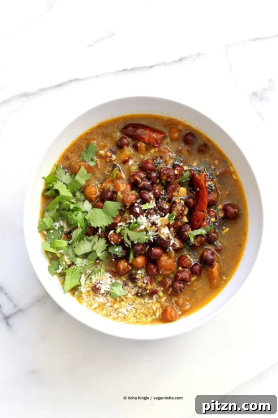 Kadala Curry - Bengal Gram or Kala Chana Curry with Coconut and Spices. Brown Chickpea Coconut Curry from South India (Kerala). Serve with rice, appams, dosas or make a bowl with roasted veggies and grains. Vegan Gluten-free Soy-free Indian Recipe | VeganRicha.com