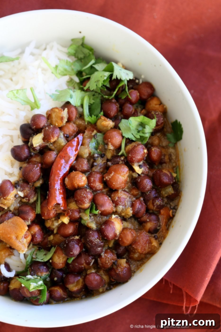 Kadala Curry - Bengal Gram or Kala Chana Curry with Coconut and Spices. Brown Chickpea Coconut Curry from South India (Kerala). Serve with rice, appams, dosas or make a bowl with roasted veggies and grains. Vegan Gluten-free Soy-free Indian Recipe | VeganRicha.com