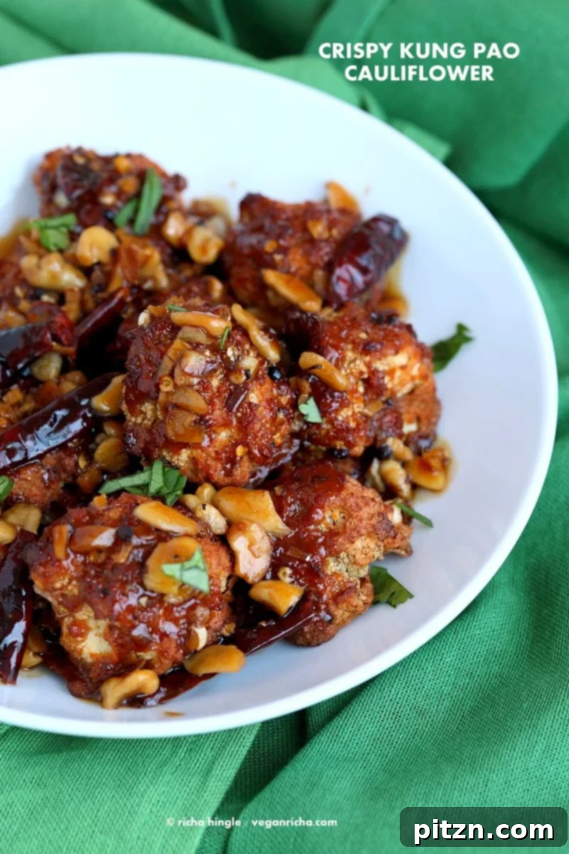 Crispy Kung Pao Cauliflower. Cauliflower battered and baked and tossed in spicy kung pao sauce. | VeganRicha.com #vegan #appetizer #snack #cauliflower #kungpao #recipe