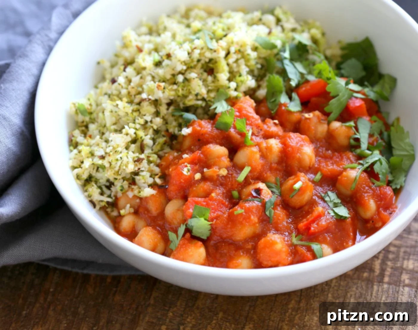 Flavorful Spanish Chickpea Stew with Cumin scented Cauliflower Broccoli Rice. Smoky tomatoey Chickpea Stew can be served over rice or grains or cauliflower or broccoli rice. Vegan Gluten-free Nut-free Grain-free Soy-free Recipe | VeganRicha.com