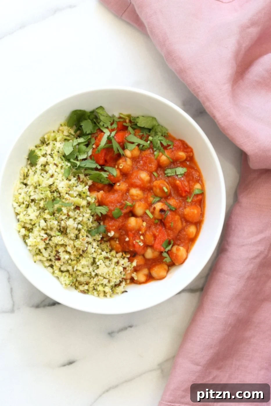 Flavorful Spanish Chickpea Stew with Cumin scented Cauliflower Broccoli Rice. Smoky tomatoey Chickpea Stew can be served over rice or grains or cauliflower or broccoli rice. Vegan Gluten-free Nut-free Grain-free Soy-free Recipe | VeganRicha.com