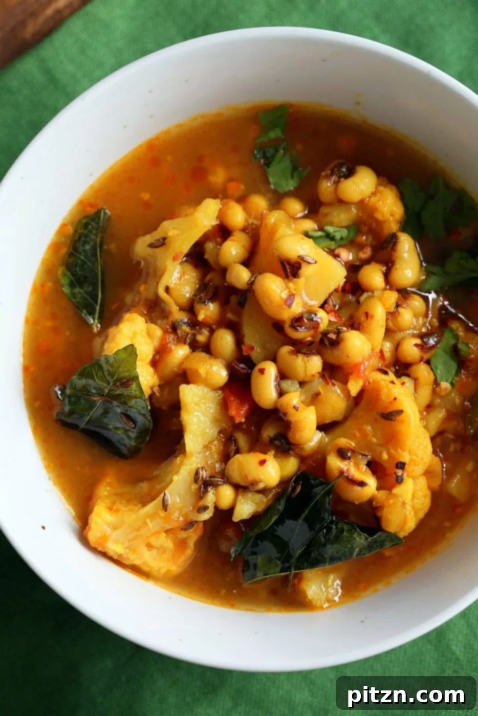 Hearty Coconutty Black Eyed Pea Curry with Cauliflower and Potatoes. Instant Pot Black Eyed Pea Curry with vegetables, suitable for Saucepan cooking. A delicious Vegetarian Black Eyed Peas Recipe.