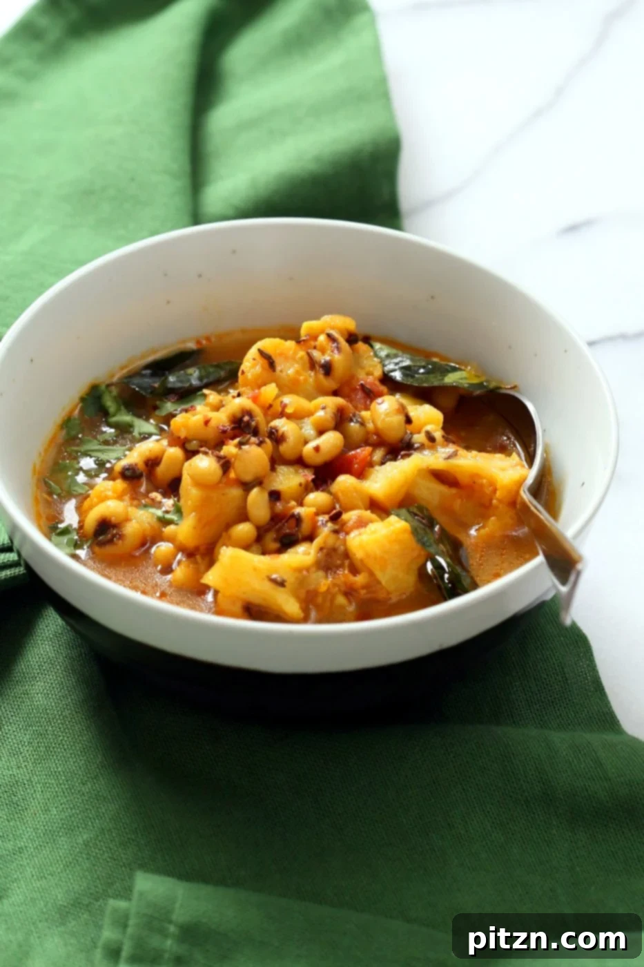 Delicious Coconutty Black Eyed Pea Curry with Cauliflower and Potatoes. An easy Instant Pot Black Eyed Pea Curry with vegetables, offering a Saucepan option. Vegetarian Black Eyed Peas Recipe.