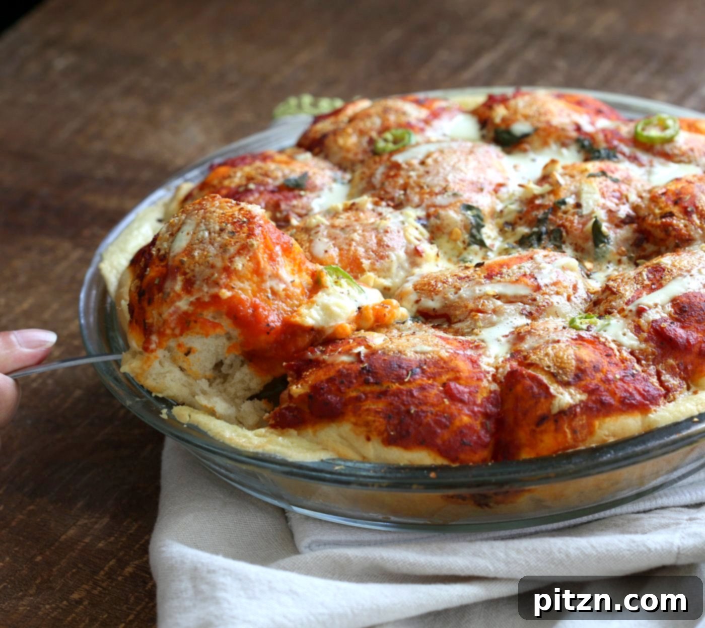 Cheesy Pizza Monkey Bread 4 Overhead shot of freshly baked Cheesy Pull Apart Pizza Bread, featuring a vibrant spread of pizza sauce, cashew cream, and fresh basil, ready for sharing. Vegan and soy-free for everyone to enjoy.