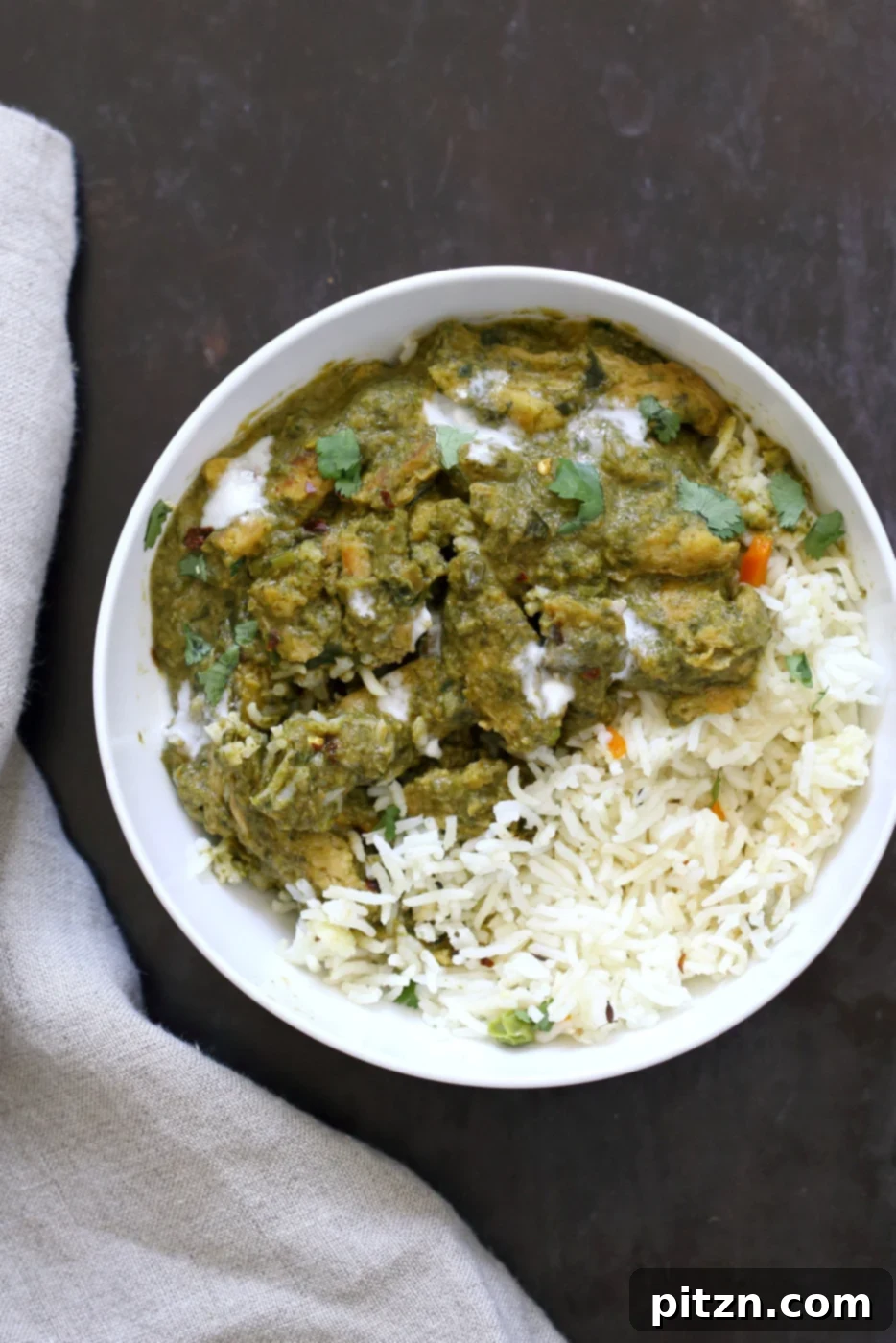 A delicious bowl of Instant Pot Vegan Chicken Saag with Soy Curls, garnished with fresh herbs and chili flakes. A perfect plant-based meal. #Vegan #Glutenfree #Recipe