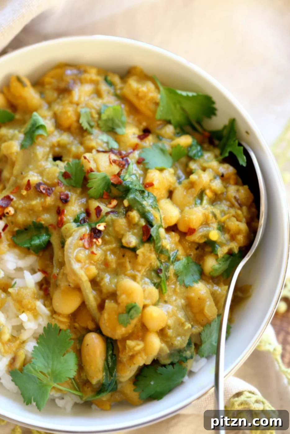Quick and Easy Cannellini and Lentil Jamaican Curry. A 30-minute one-pot recipe featuring creamy coconut milk, vibrant Jamaican spices, cannellini beans, and red lentils. Perfect for a high-protein, vegan, gluten-free, soy-free, nut-free dinner. | VeganRicha.com
