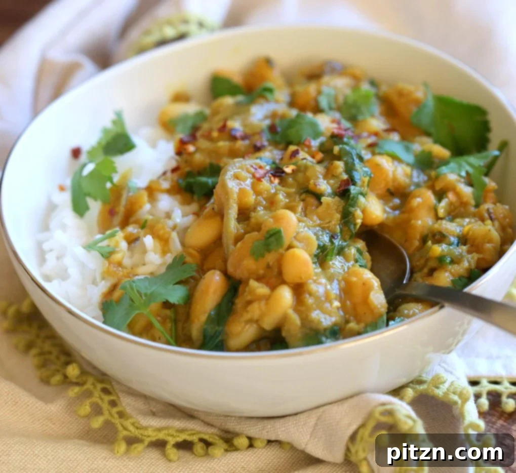 Delicious and nutritious Cannellini and Lentil Jamaican Curry. A vegan, gluten-free, soy-free, nut-free, high-protein recipe made in one pot in just 30 minutes. Features coconut milk, Jamaican curry spices, white beans, and red lentils. | VeganRicha.com