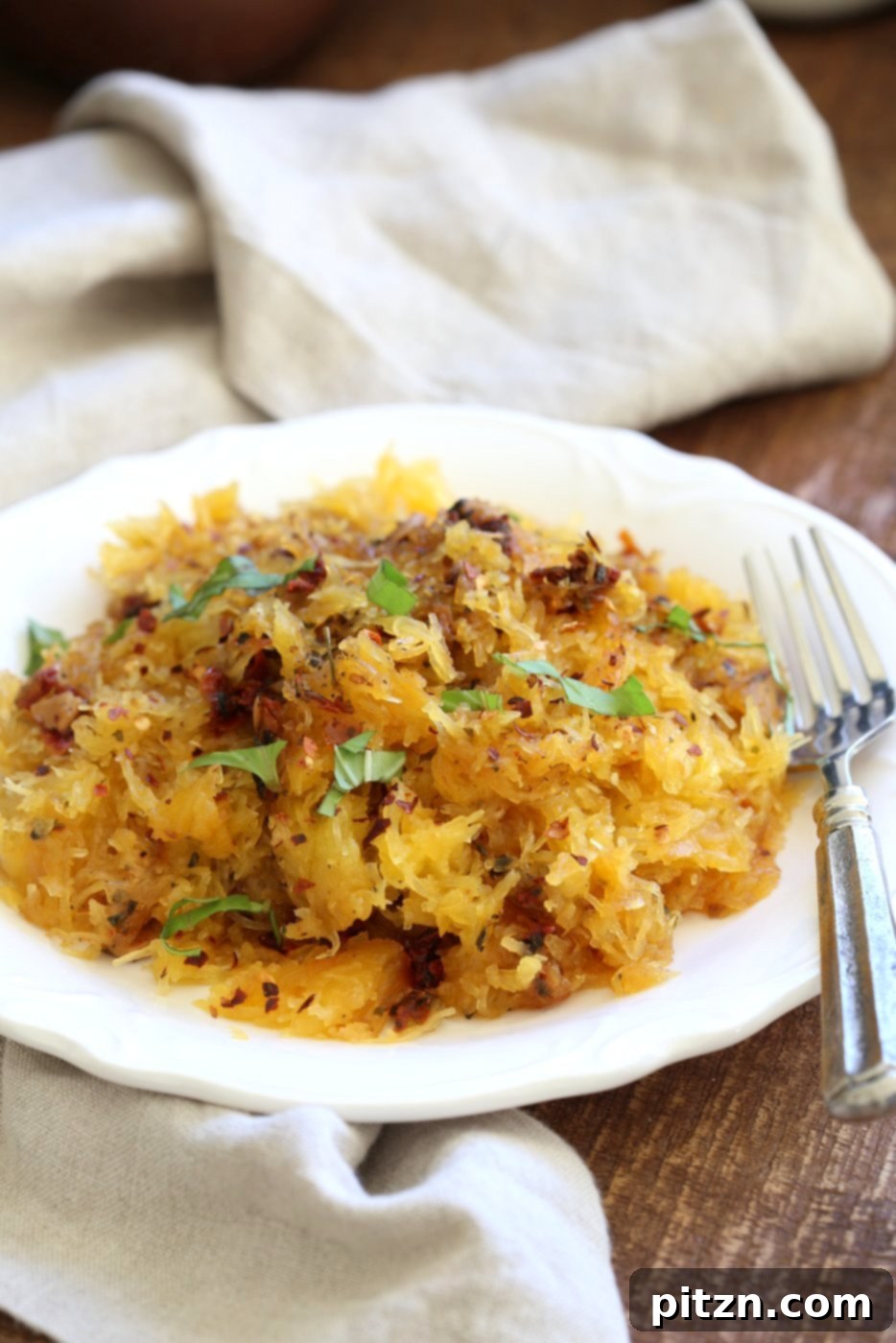 Close-up of Spaghetti Squash Pasta with Sun-dried Tomato, Garlic & Basil, showcasing its vibrant colors and noodle-like texture