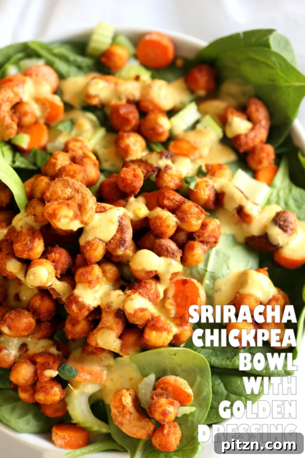 Spicy Sriracha Chickpea Cashew Spinach Power Bowl with Golden Curry 8 A close-up of a Sriracha Chickpea, Cashew, and Spinach Bowl with Ranch Curry Dressing, showcasing texture and color