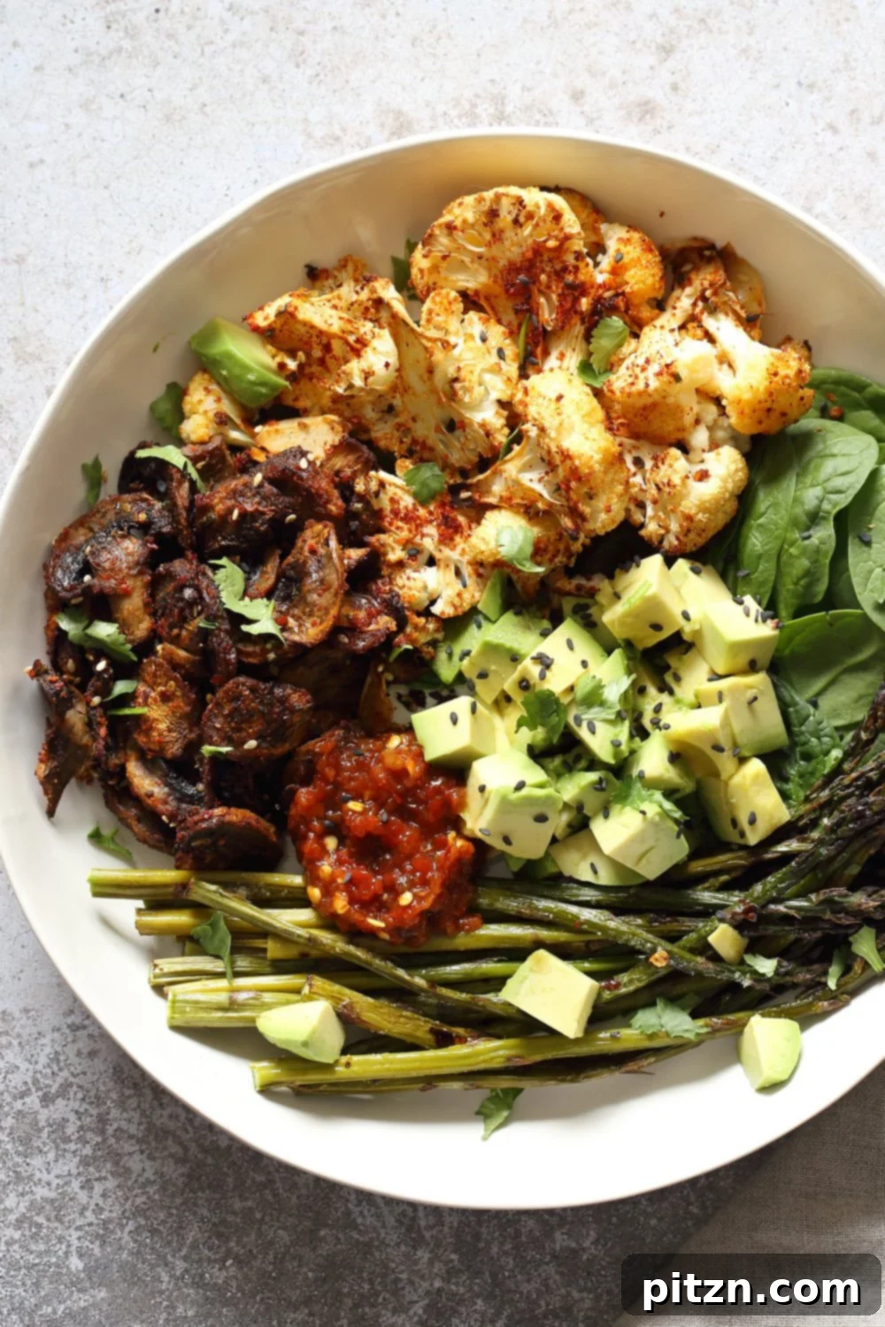 Bulgogi Roasted Spring Veggie Bowl. Spicy, sweet Korean Gochugaru blend roasted Cauliflower Mushroom Asparagus Bowl. Ready to serve.