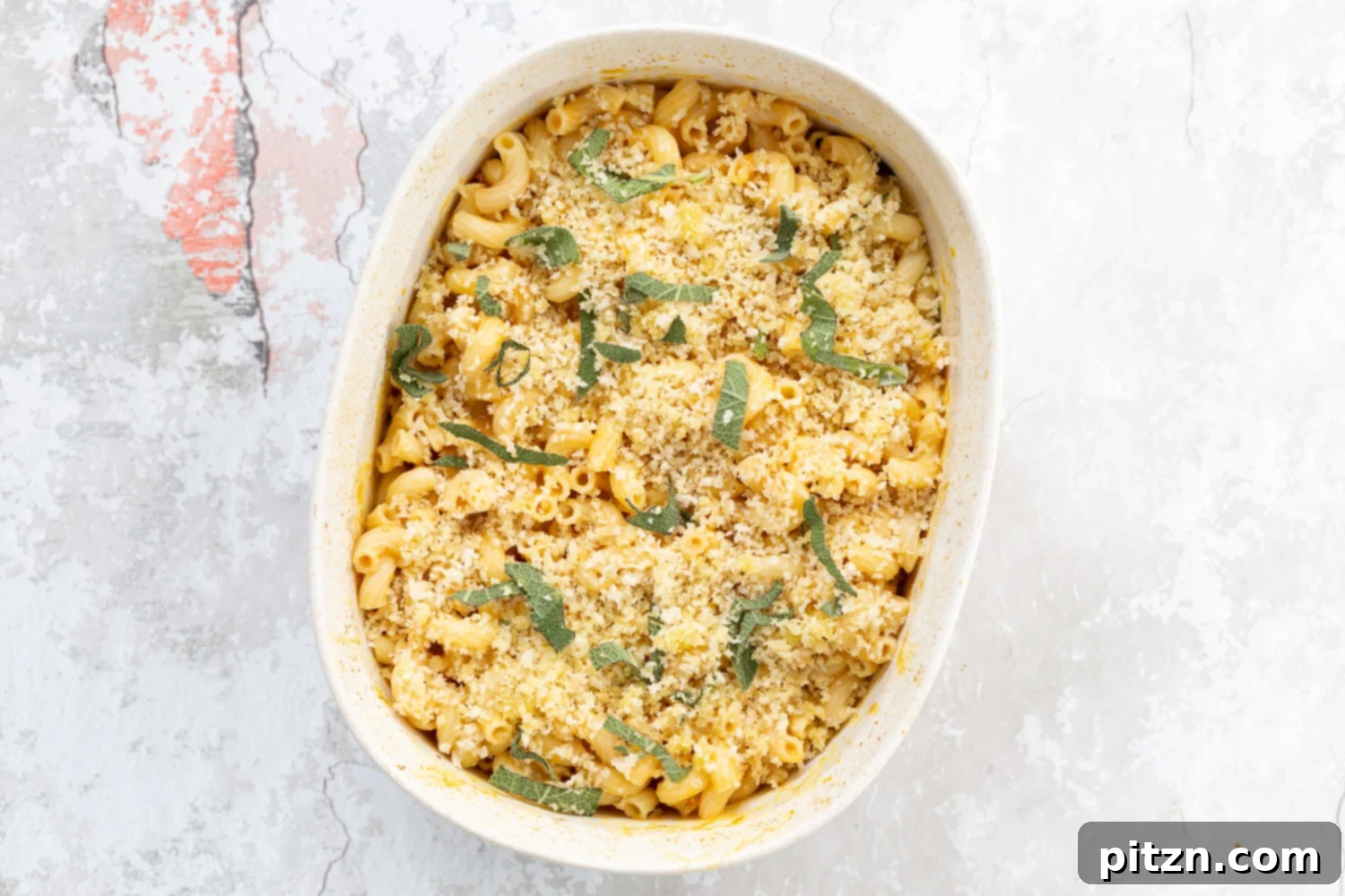 Golden Harvest Vegan Mac and Cheese Bake 8 A comforting portion of Vegan Pumpkin Mac and Cheese, ideal for a plant-based dinner.