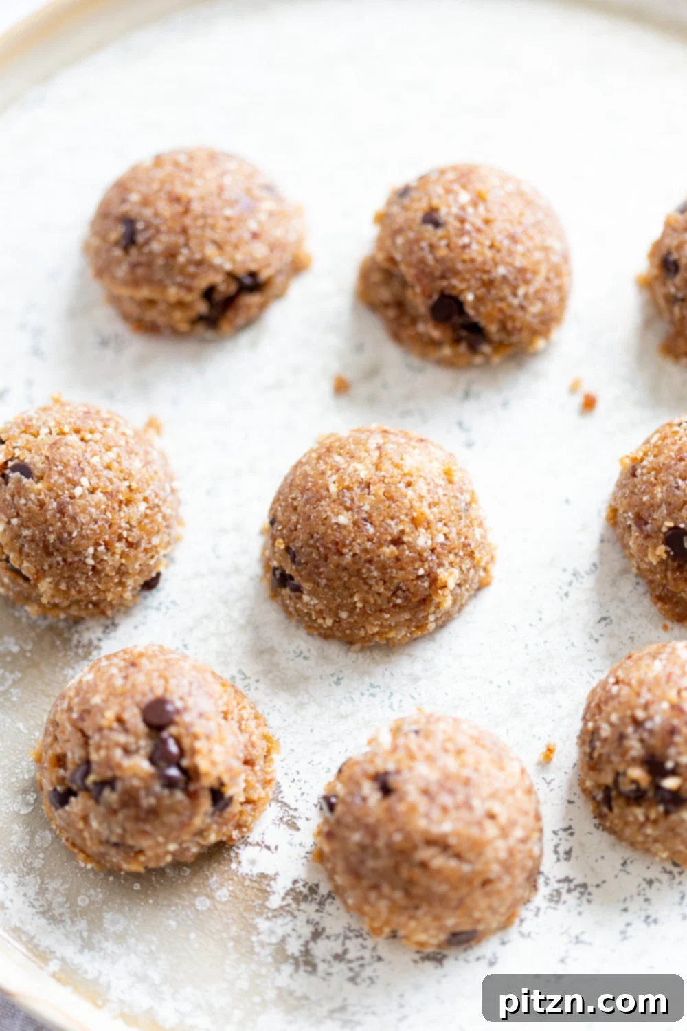 No-Bake Vegan Dough Delights 3 A close-up shot of our finished Vegan Cookie Dough Bites arranged beautifully on a white plate.