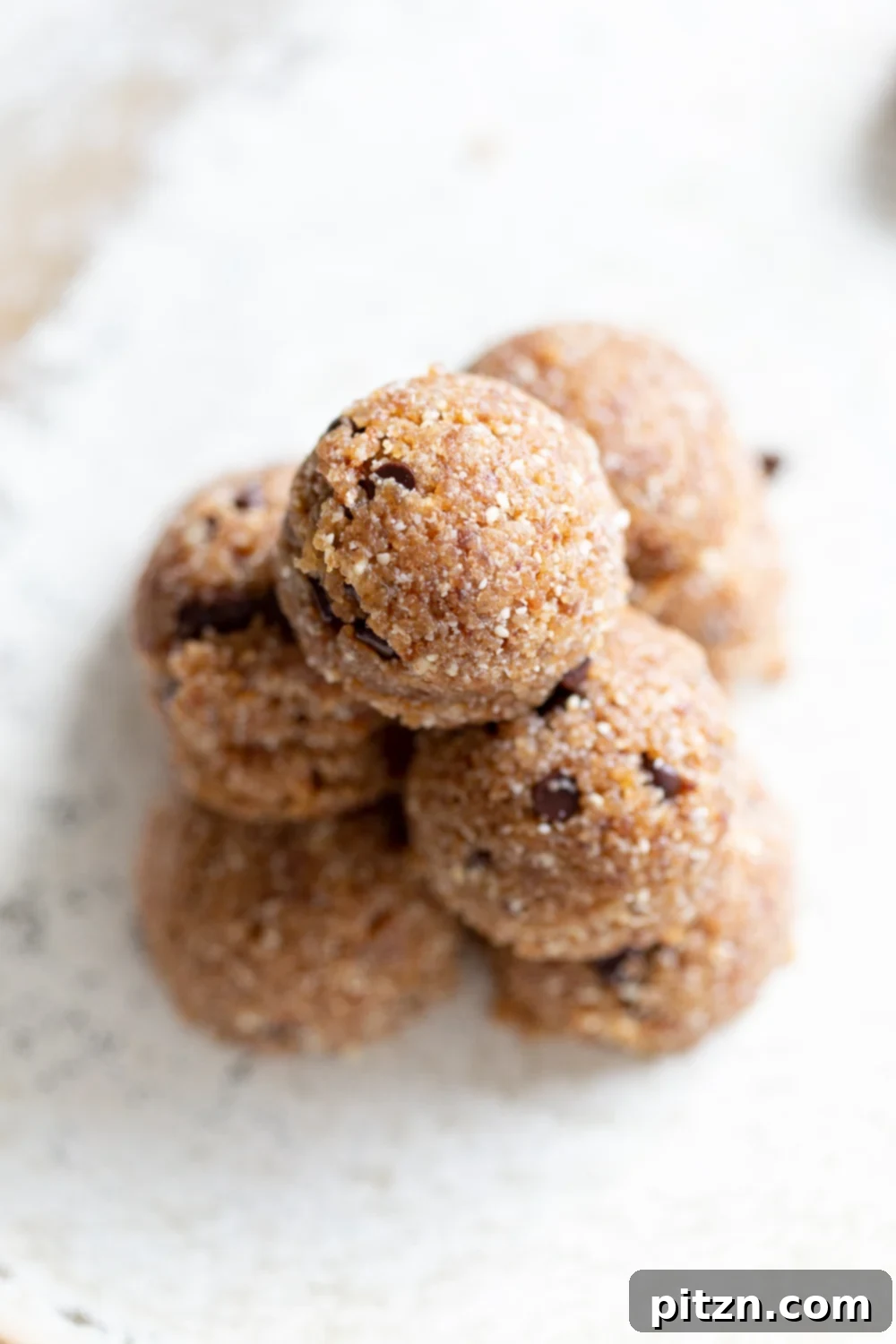 No-Bake Vegan Dough Delights 9 Another beautiful shot of our Vegan Cookie Dough Bites elegantly presented on a white plate, ready to be enjoyed.