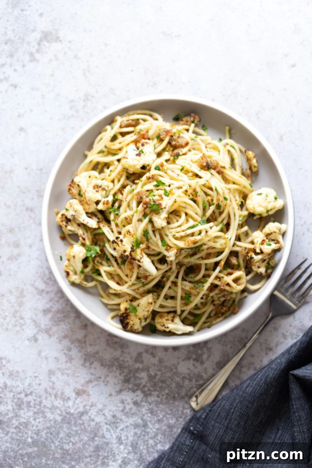 Spaghetti with Crispy Garlic Crumbs and Smoky Roasted Cauliflower 2 Easy Spaghetti with toasted garlic breadcrumbs and blistered cauliflower. 30 Min Vegan Pasta Meal with toasted breadcrumbs and roasted cauliflower. Vegan Nutfree Soyfree Recipe
