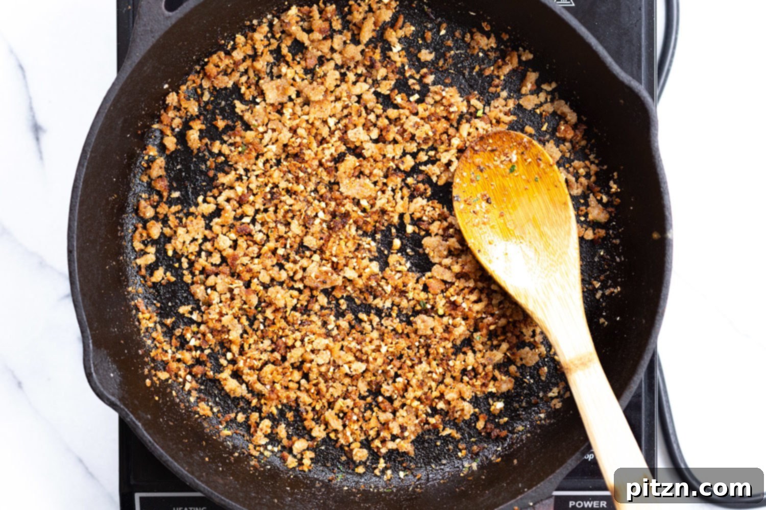 Toasted garlic breadcrumbs in cast iron skillet for our Spaghetti with toasted garlic breadcrumbs 