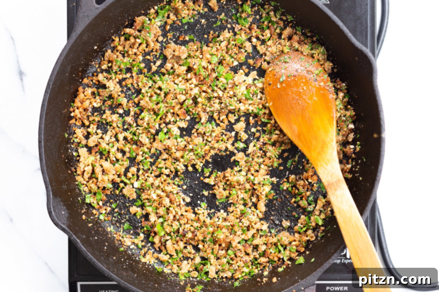 Spaghetti with Crispy Garlic Crumbs and Smoky Roasted Cauliflower 7 Toasted garlic breadcrumbs in cast iron skillet for our Spaghetti with toasted garlic breadcrumbs