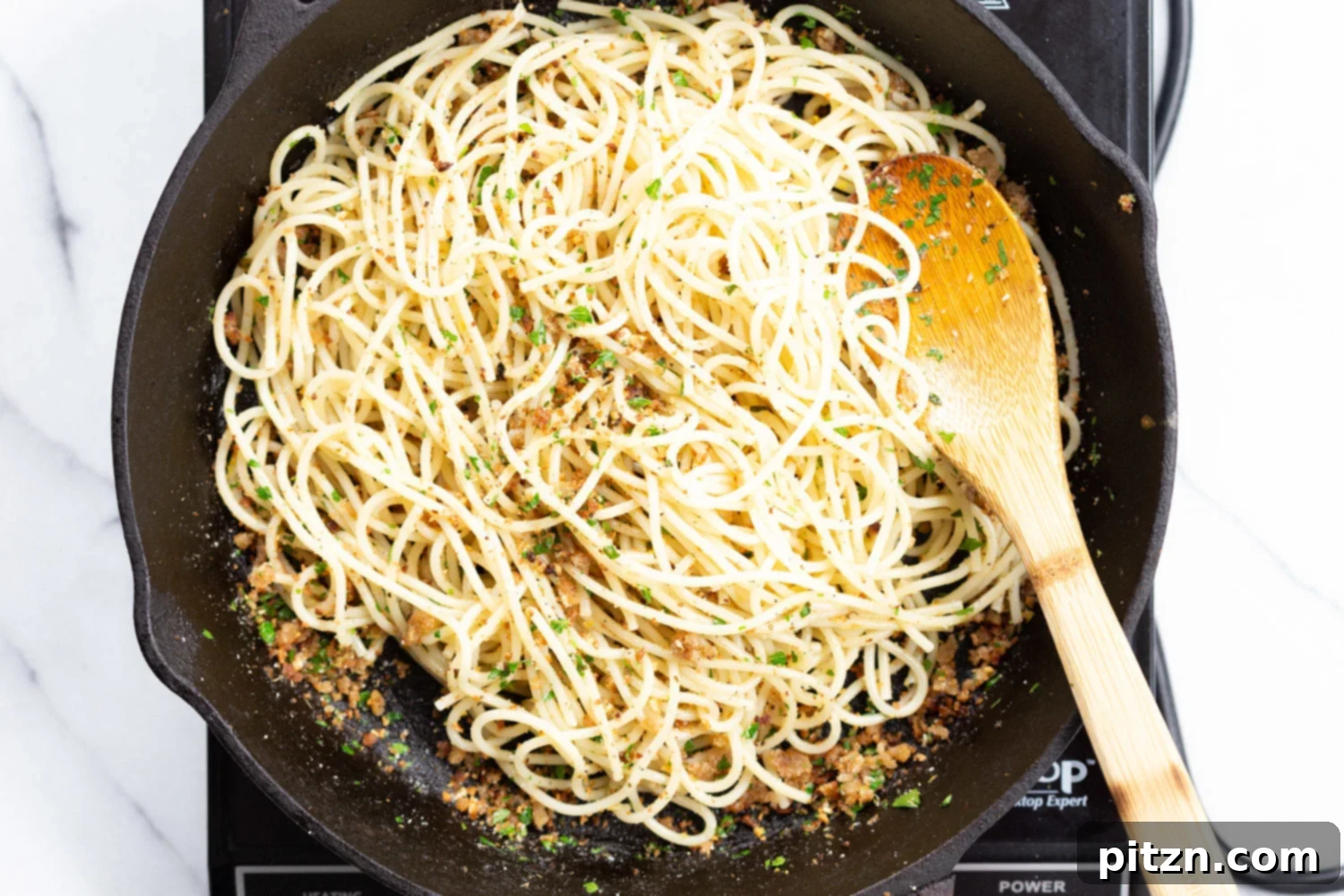 Easy Spaghetti with toasted garlic breadcrumbs and blistered cauliflower. Vegan Pasta with breadcrumbs, pasta wth roasted cauliflower. #Vegan #Nutfree #Soyfree #Recipe #spaghetti #toastetdbreadcrumbs #VeganRicha