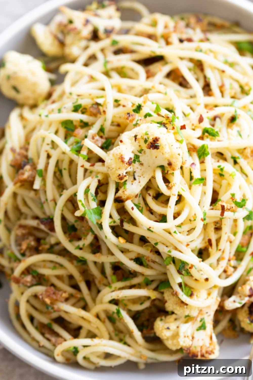Spaghetti with Crispy Garlic Crumbs and Smoky Roasted Cauliflower 10 Easy Spaghetti with toasted garlic breadcrumbs and blistered cauliflower. Vegan Pasta with breadcrumbs, pasta wth roasted cauliflower. #Vegan #Nutfree #Soyfree #Recipe #spaghetti #toastetdbreadcrumbs #VeganRicha