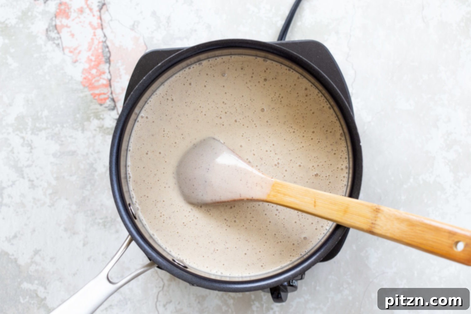 Vegan Coconut Vanilla Ice cream for our Vegan Cookie Dough Ice Cream Sandwiches cooking in a saucepan 