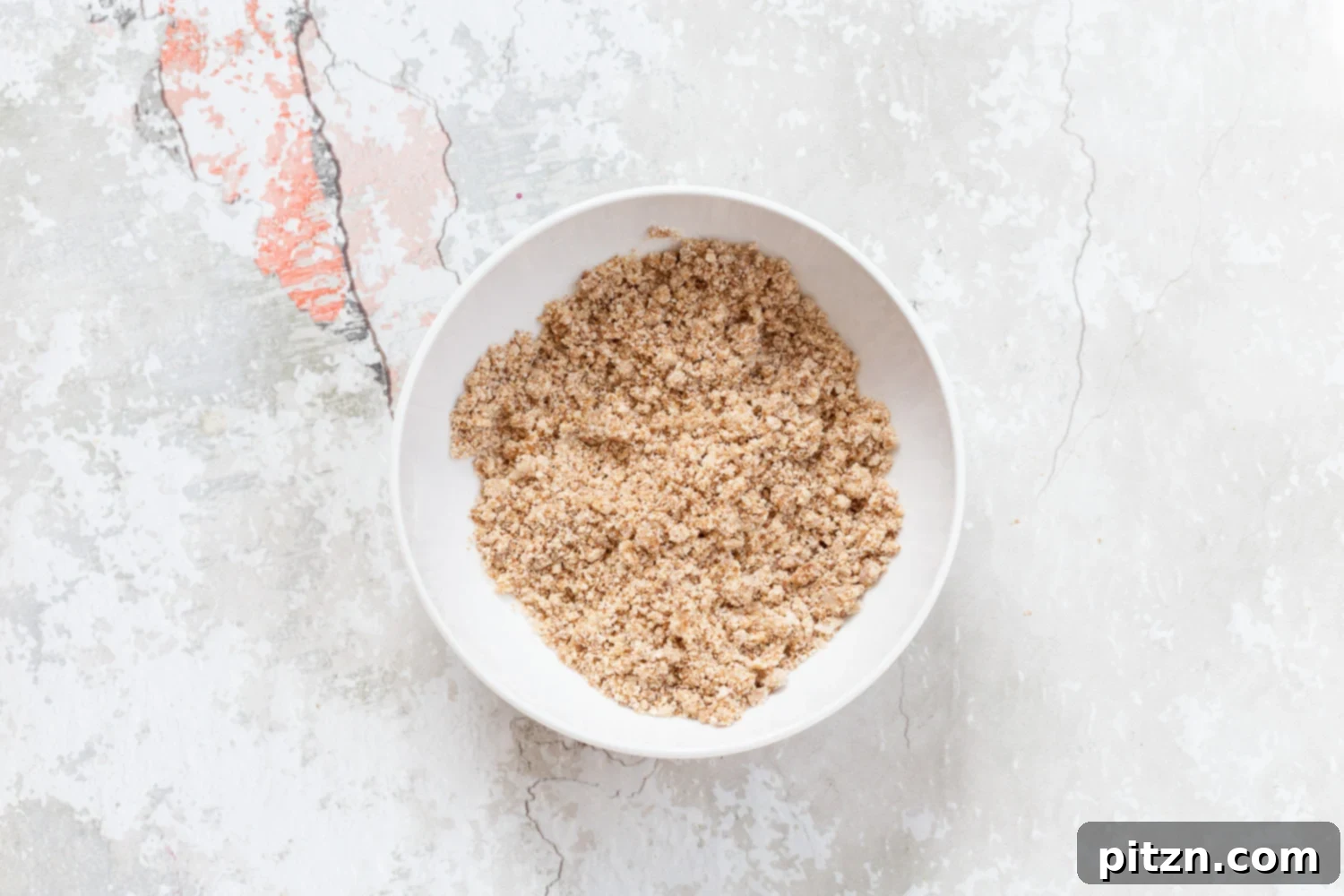 Streusel for our Vegan Blueberry Muffins in a white bowl
