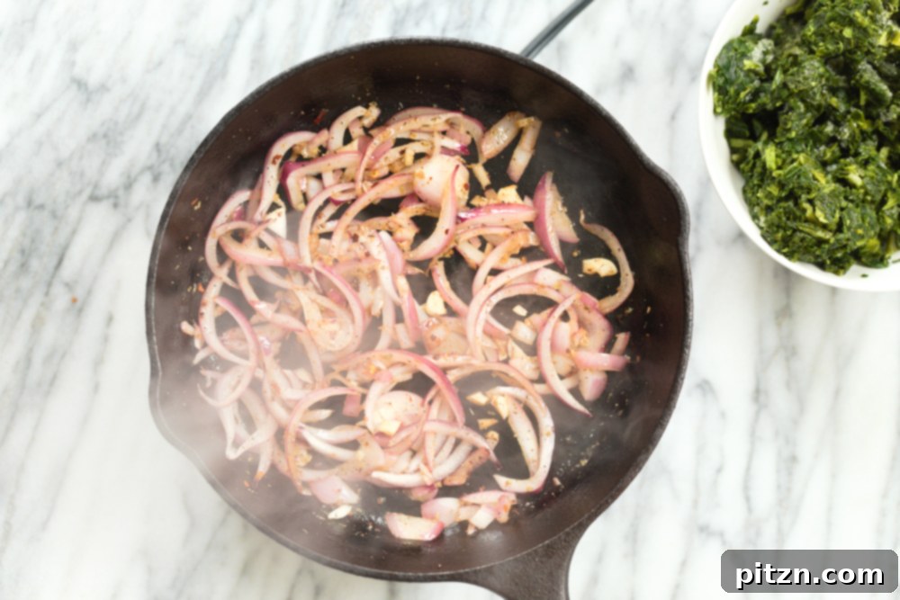 onion and garlic in cast iron skillet