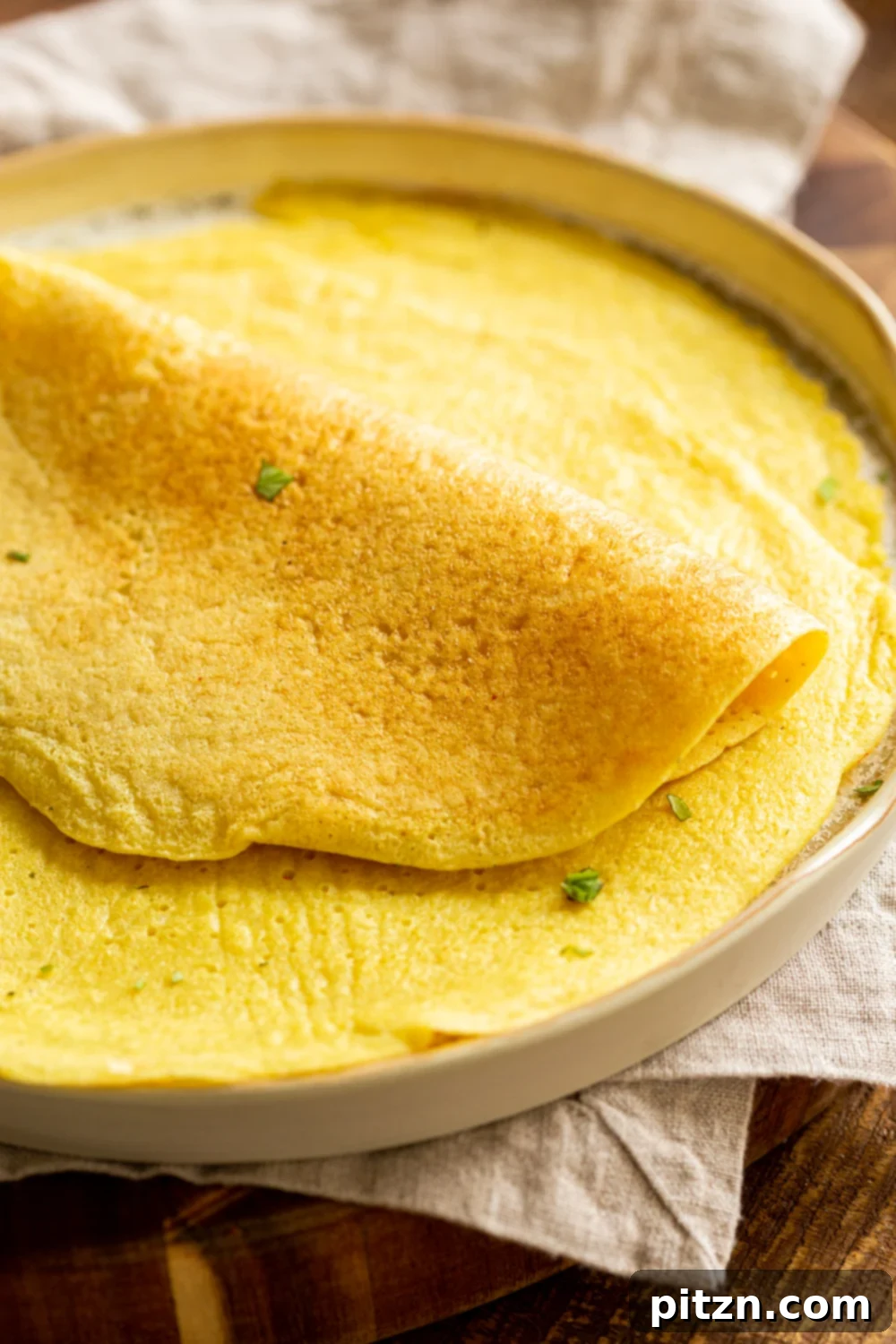 A perfectly plain Vegan Omelet made with mung beans, ready to be customized or enjoyed simply