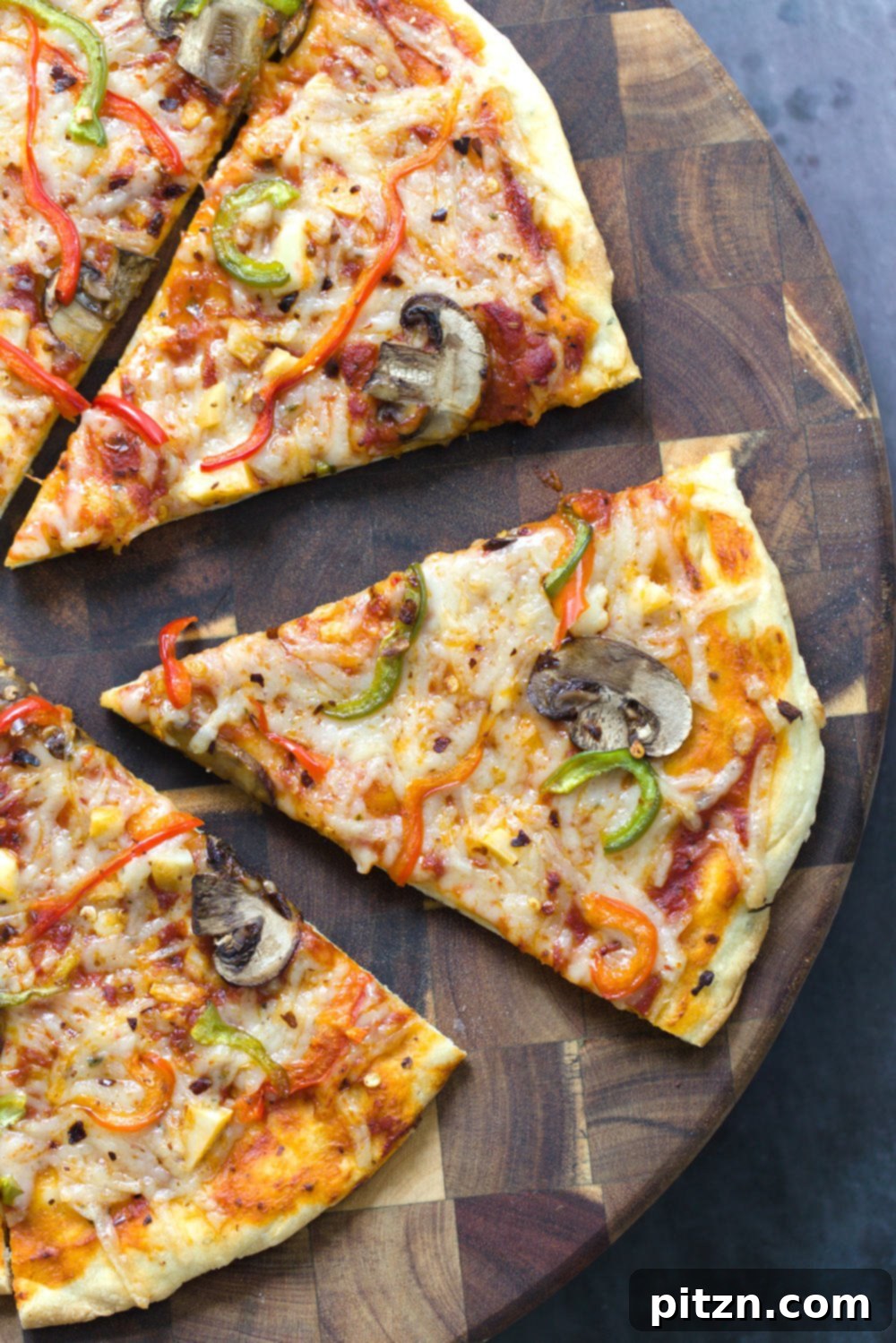 no yeast pizza dough overhead shot of a freshly baked vegan pizza cut into wedges