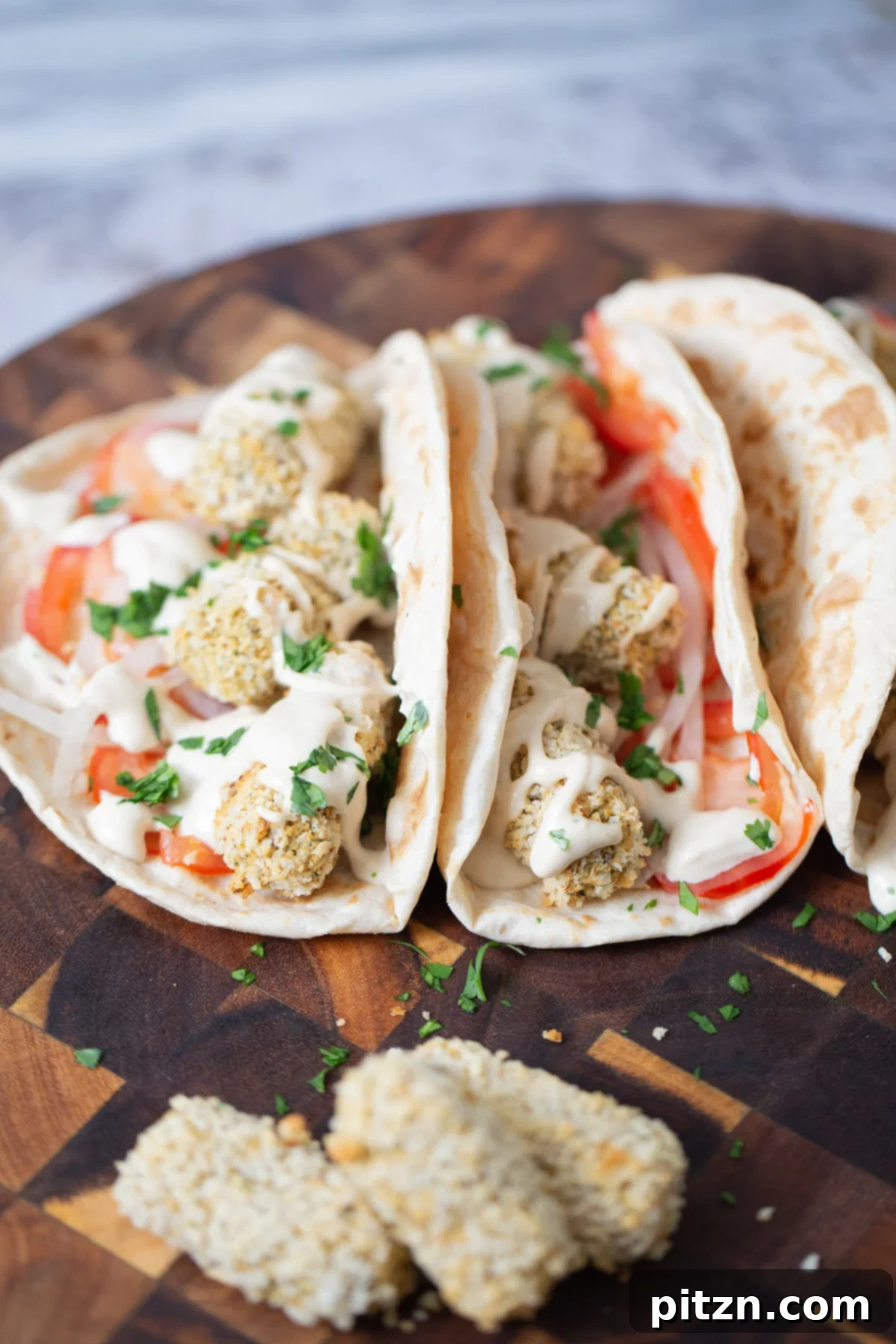 close-up of wraps filled with vegan croquettes and veggies 
