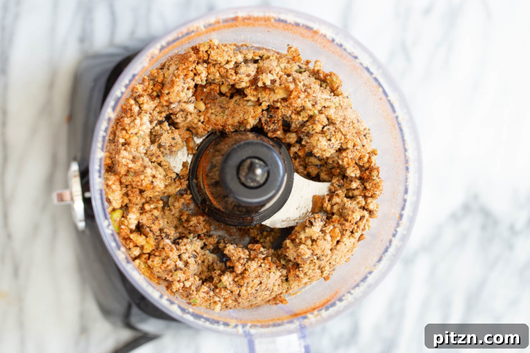 overhead shot of vegan walnut taco meat in a food processor
