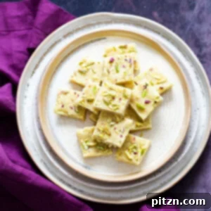 Rich Plant-Based Almond Burfi 2 Vegan almond burfi on a plate ready to be served