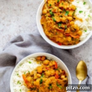 A vibrant bowl of Pumpkin Chickpea Curry, ready to serve.