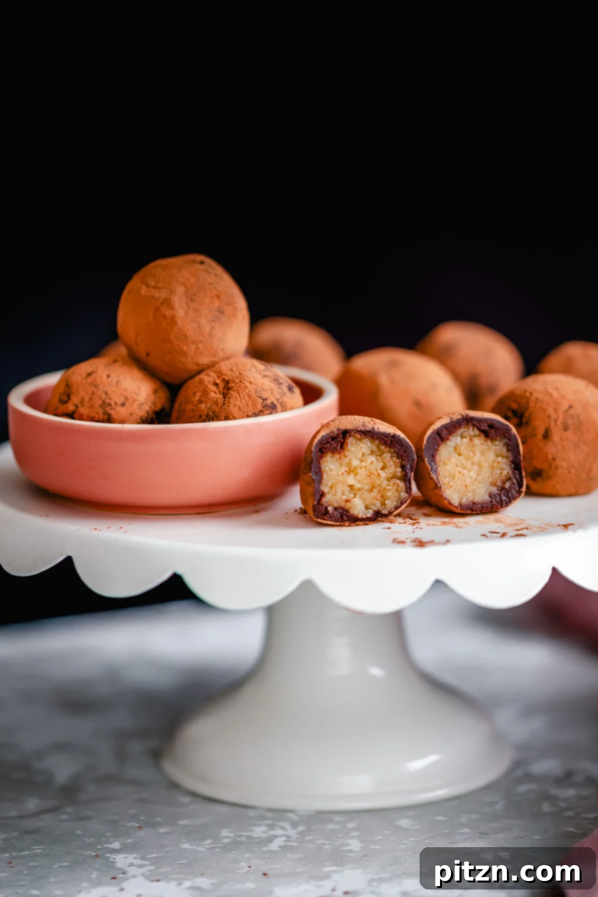 tiramisu truffles vegan tiramisu truffles on a cake stand with one truffle cut open