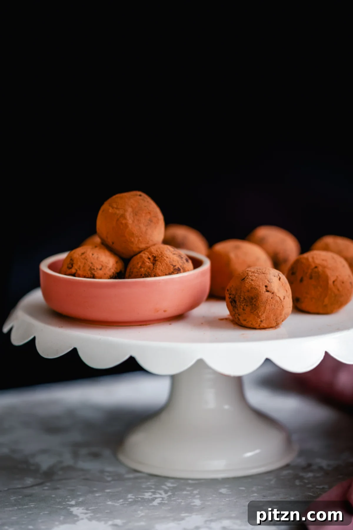 tiramisu truffles vegan tiramisu truffles rolled in cocoa powder presented on a cake stand