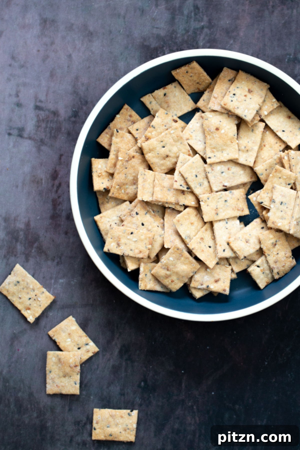 a bowl with vegan Everything But the Bagel Crackers 
