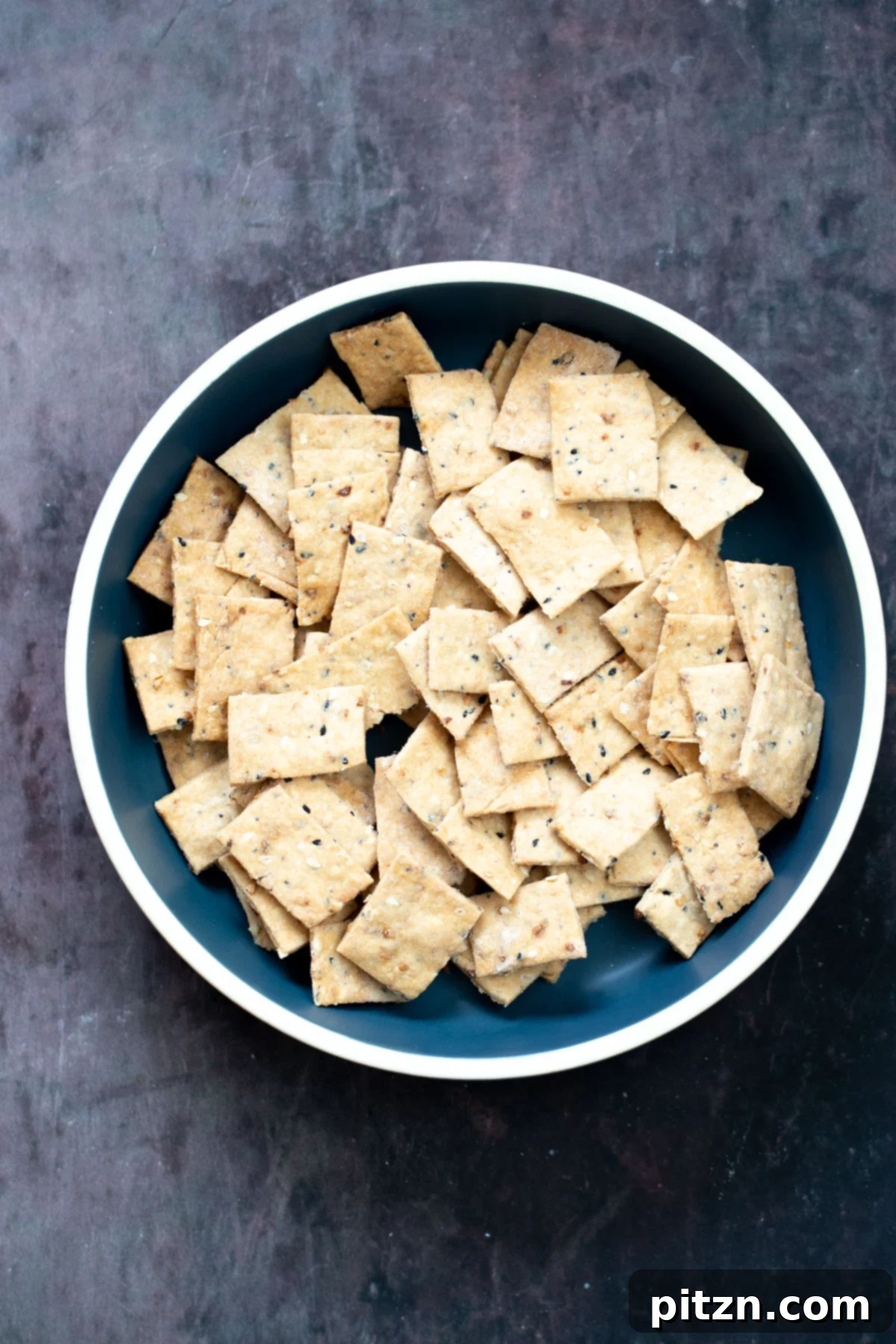 a bowl with homemade everything but the bagel crackers 