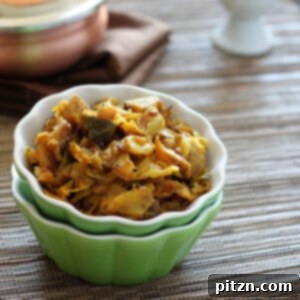 Burnt Chili Patta Gobi Aloo: Spicy Vegan Gluten-Free Cabbage and Potatoes 5 Spiced cabbage and potato in a small green bowl, garnished